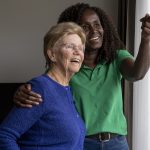 Helper caring for elderly lady